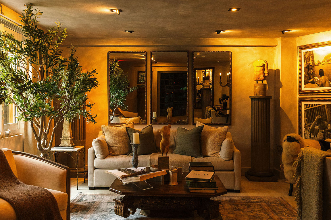 Warm and elegant Mediterranean-inspired lobby of O:live Boutique Hotel in Condado, San Juan, Puerto Rico, featuring curated art and luxury vintage décor.